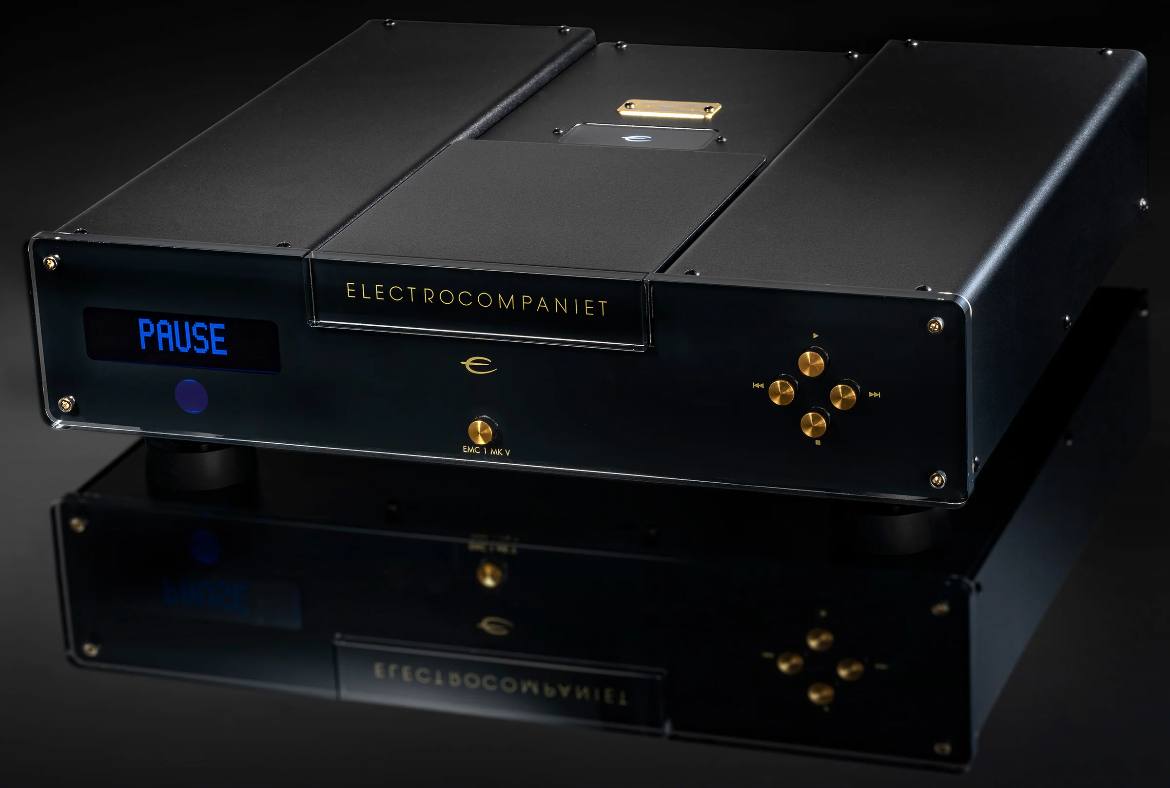 Electrocompaniet EMC 1 MK V player in black with gold controls, PAUSE lit in blue