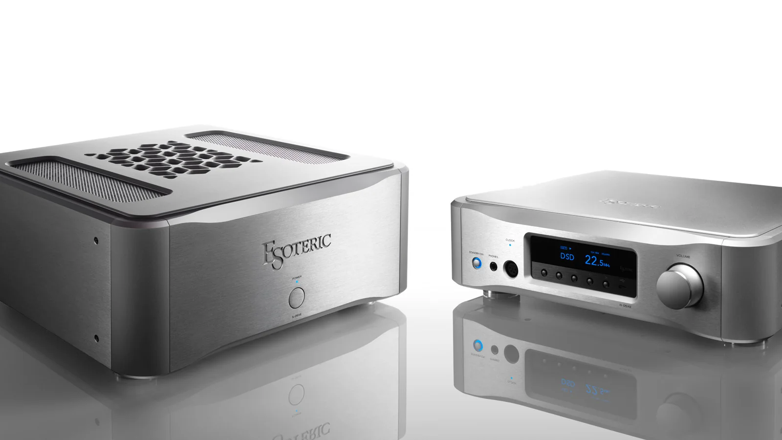 An Esoteric power amplifier and network player in brushed silver, mirrored on white