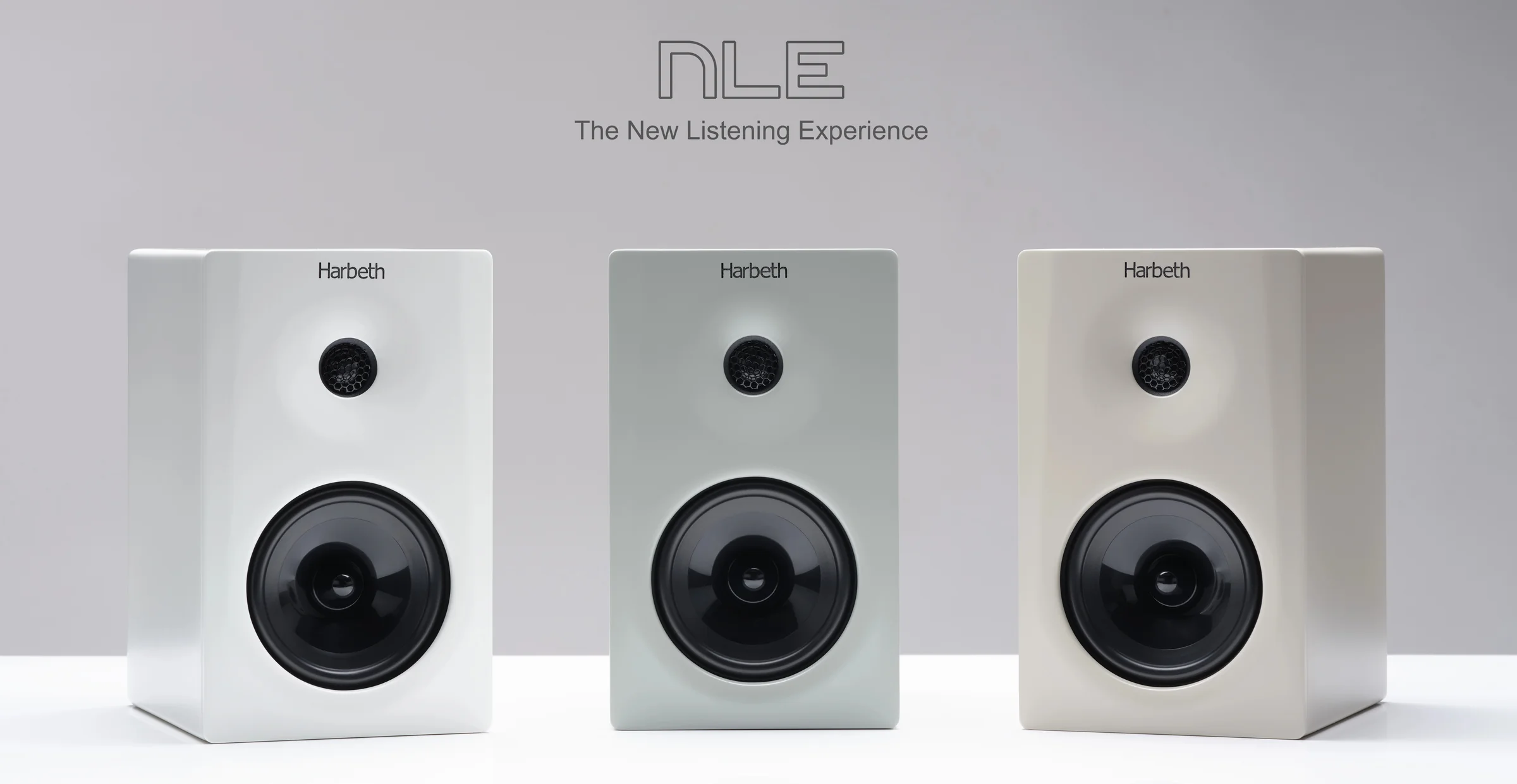 Three white Harbeth NLE monitors in a row on a pale ground