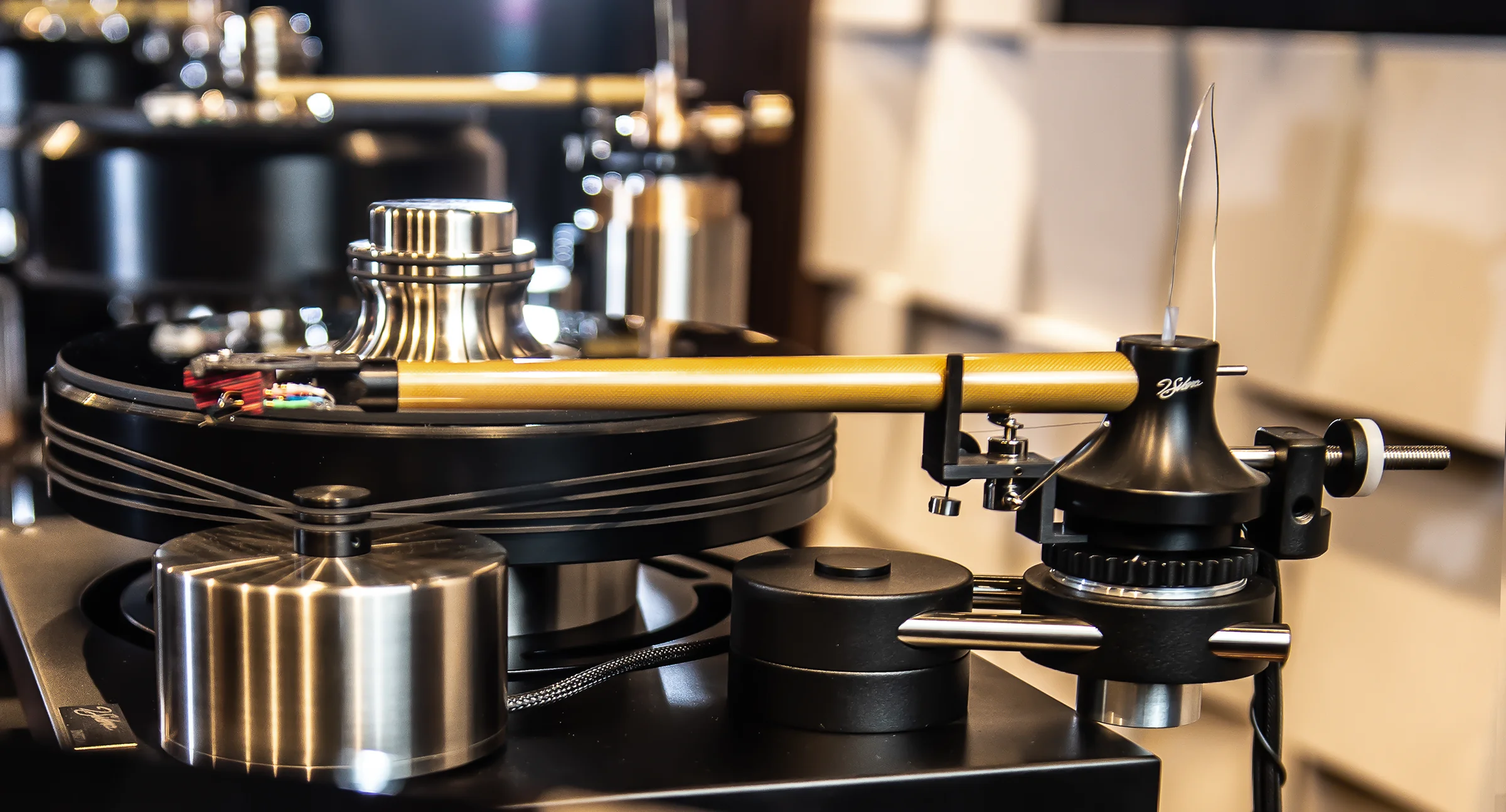 A J. Sikora turntable in close-up: machined brass and steel around the platter