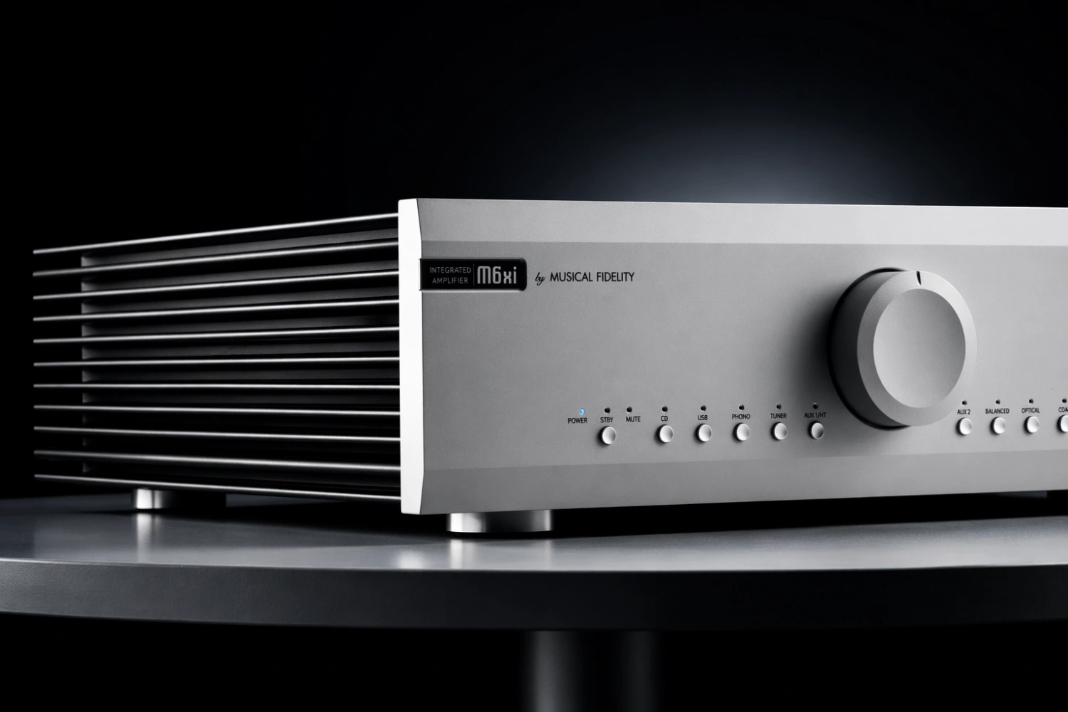 A Musical Fidelity integrated amplifier in silver, heatsink fins catching the light
